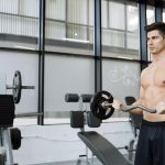 Prolonged Use of Steroids: How Long Does Proviron Take to Work? Muscular man bodybuilding in gym